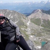 Marion on top of 3035 meters high Hexenkopf with the Ötztaler Alps in the back